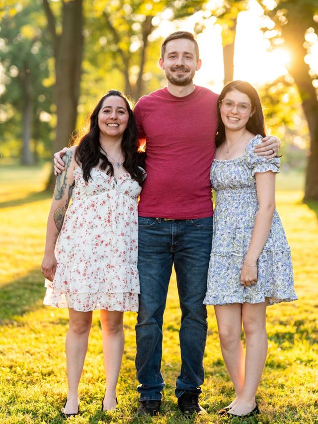 Amy with her family in a sunny park